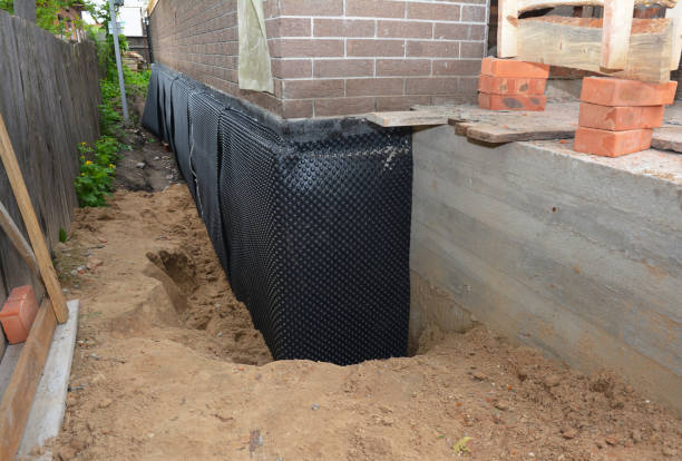 Happy homeowners after waterproofing job in Occoquan